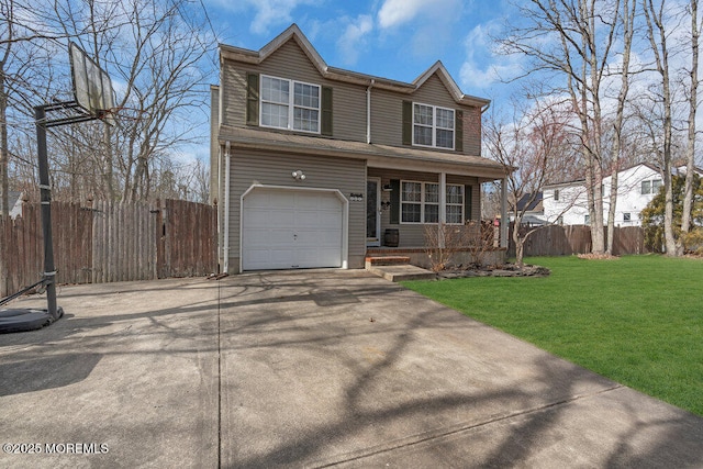 traditional-style house featuring a garage, fence, concrete driveway, and a front yard