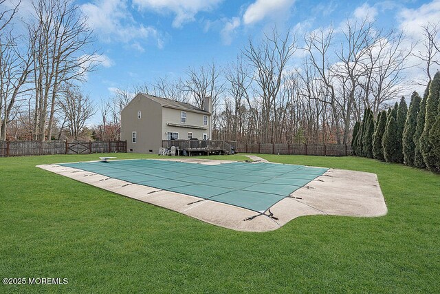 view of pool featuring a fenced backyard, a fenced in pool, and a lawn