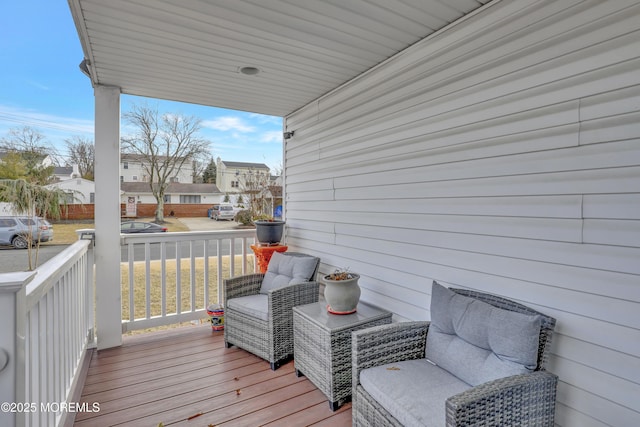 wooden terrace with a residential view