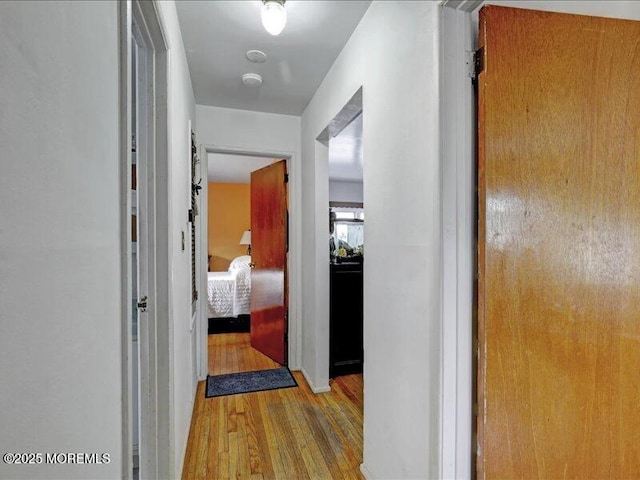 hall featuring wood finished floors