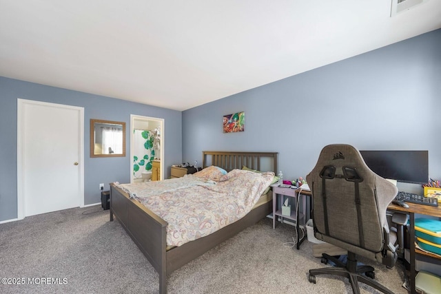 bedroom with carpet floors, visible vents, and ensuite bathroom