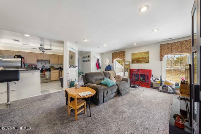 living room with light carpet, visible vents, and recessed lighting