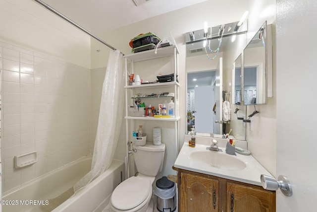 full bathroom featuring shower / tub combo, vanity, and toilet