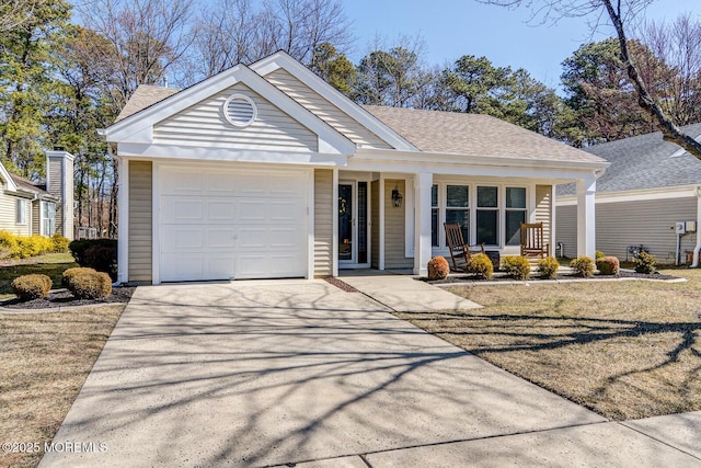 ranch-style home with a porch, concrete driveway, an attached garage, and a shingled roof