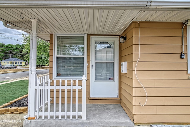 doorway to property featuring a porch