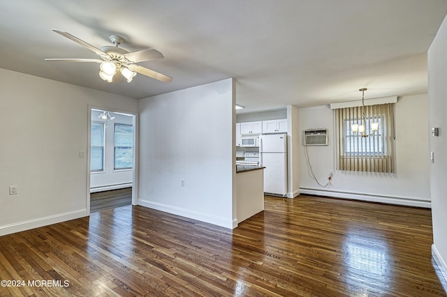 unfurnished living room with dark wood-style floors, baseboard heating, a wall mounted AC, and baseboards