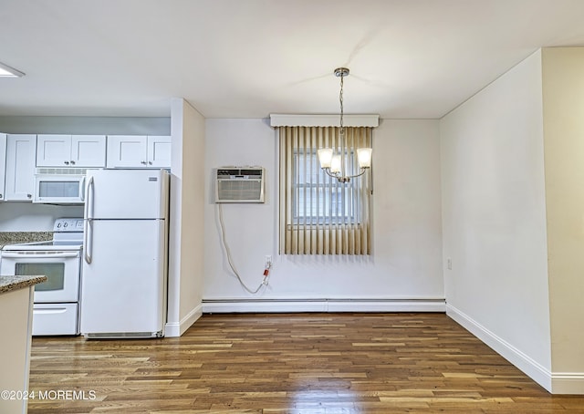 interior space featuring a notable chandelier, white appliances, wood finished floors, baseboards, and an AC wall unit