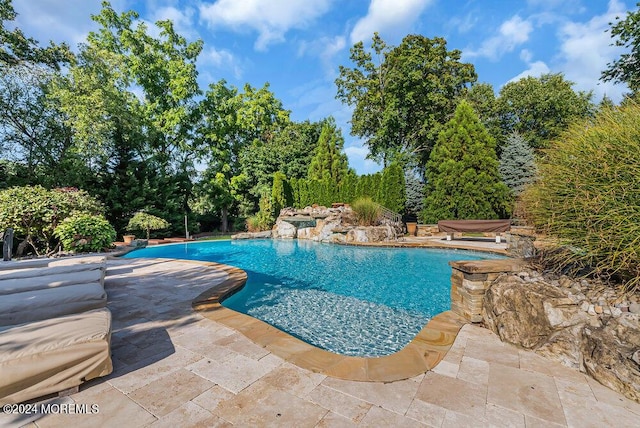 outdoor pool with a patio