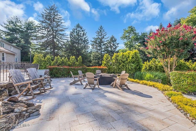 view of patio / terrace with an outdoor fire pit