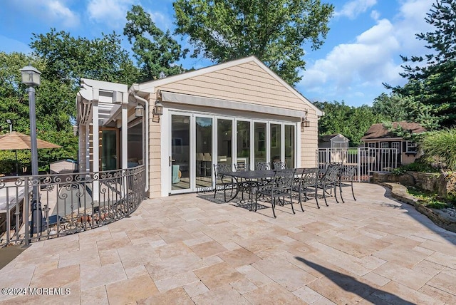 exterior space with outdoor dining space