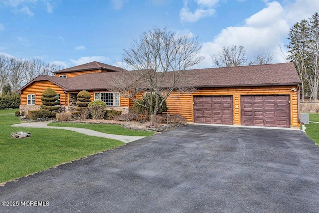 view of front of property with a garage, stone siding, aphalt driveway, roof with shingles, and a front yard