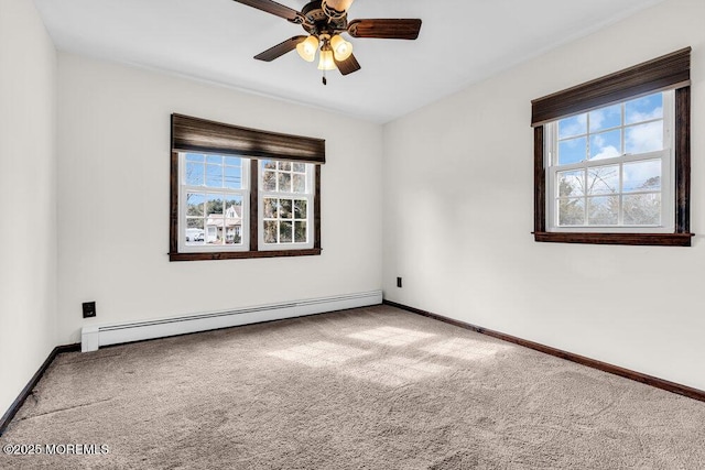 spare room featuring ceiling fan, baseboards, baseboard heating, and carpet flooring