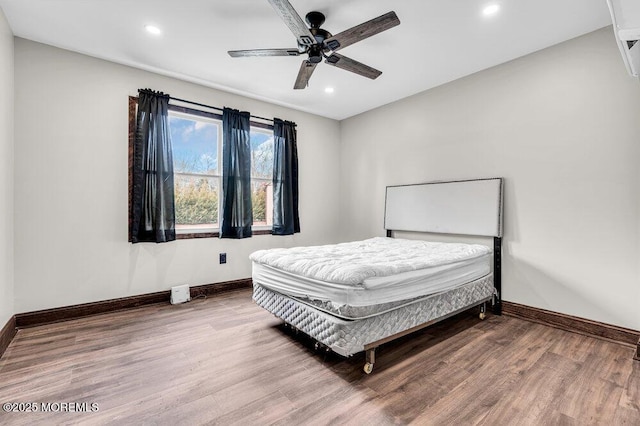 bedroom with a ceiling fan, recessed lighting, baseboards, and wood finished floors