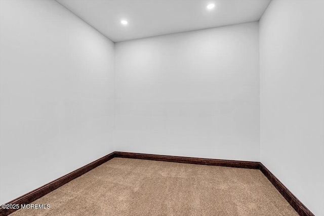 unfurnished room with carpet floors, recessed lighting, and baseboards