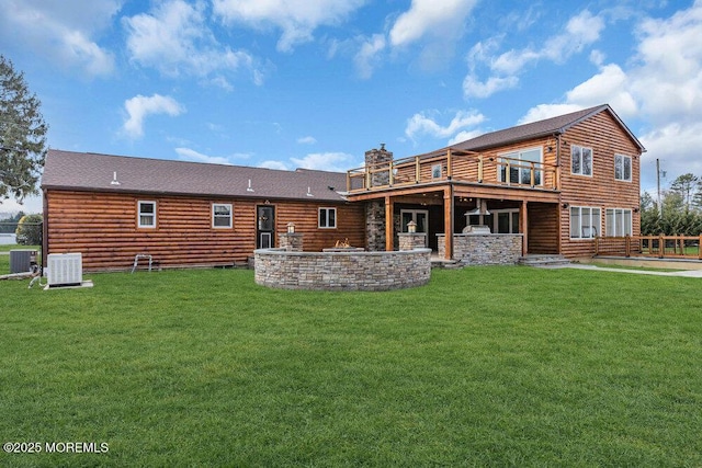 back of house with a lawn, a patio, and central AC unit