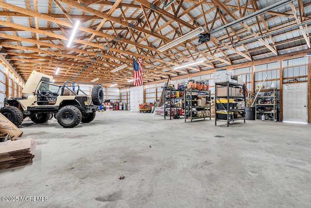 garage with metal wall and a garage door opener