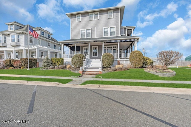 view of front of house featuring a porch and a front lawn