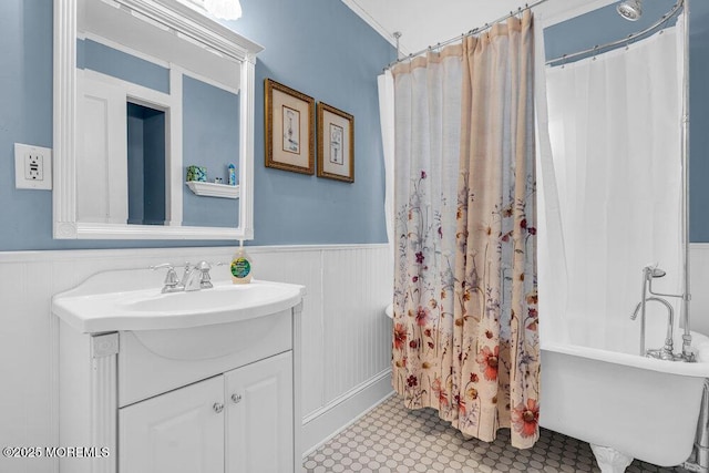 bathroom with wainscoting and vanity