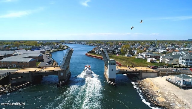 view of dock featuring a residential view and a water view