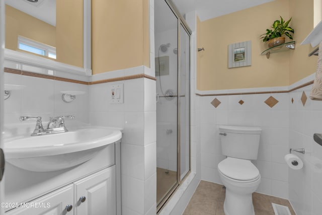 bathroom featuring visible vents, toilet, a shower stall, and tile patterned flooring