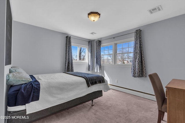 bedroom featuring carpet floors, baseboards, visible vents, and a baseboard radiator