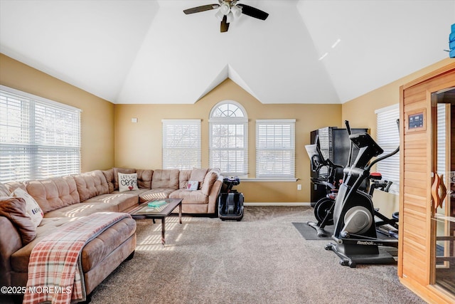 workout room featuring lofted ceiling, ceiling fan, carpet floors, and baseboards