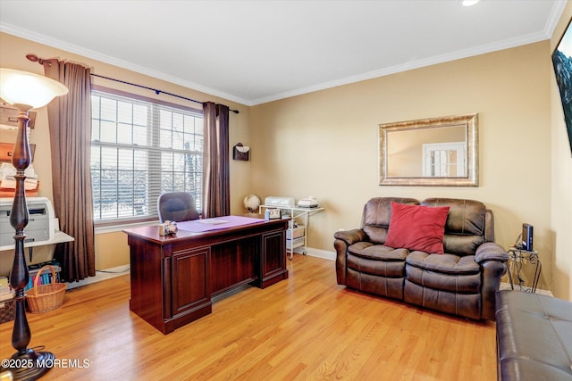 home office featuring light wood-style flooring, baseboards, and crown molding