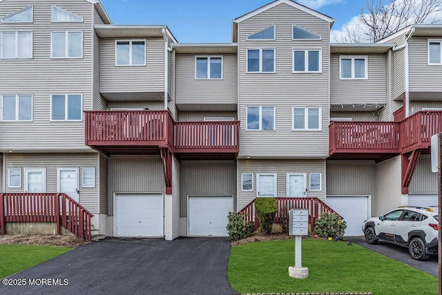 exterior space featuring an attached garage and driveway