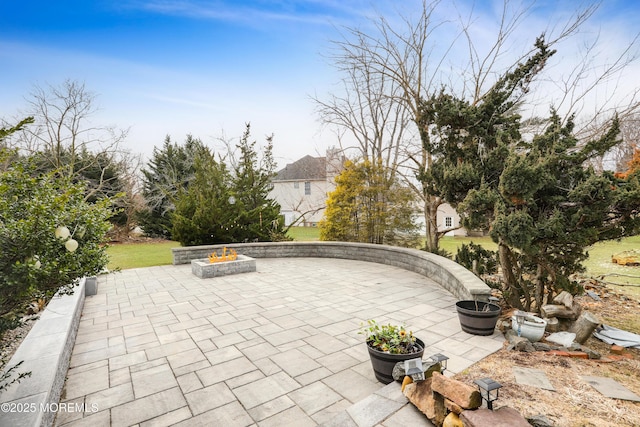 view of patio with a fire pit