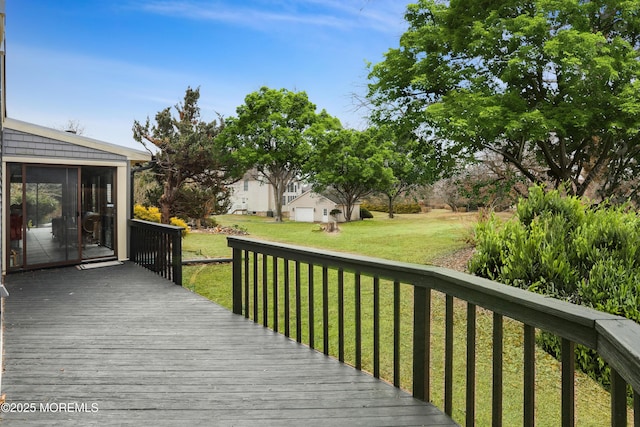 deck featuring a lawn and a sunroom