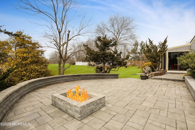 view of patio / terrace featuring an outdoor fire pit