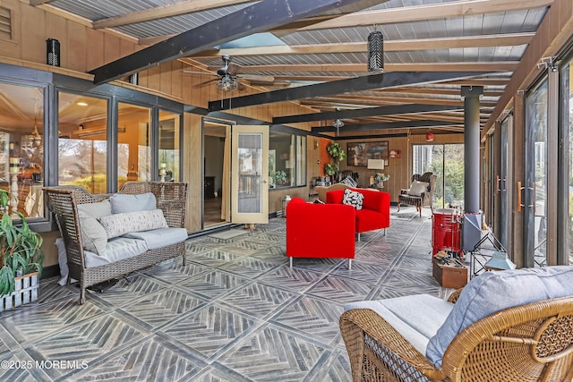 interior space featuring a ceiling fan and vaulted ceiling