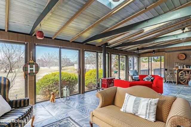 sunroom / solarium with lofted ceiling with beams