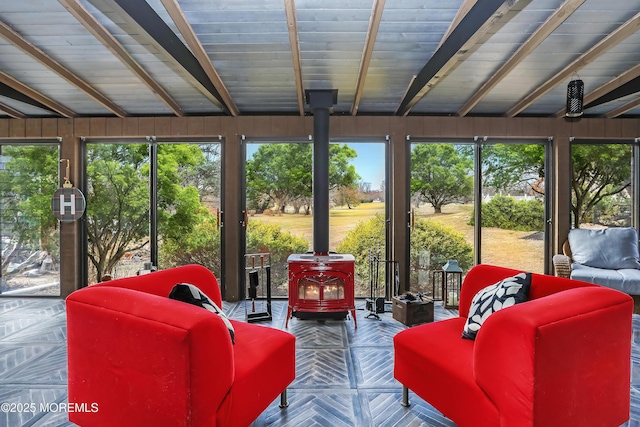 sunroom with a wood stove