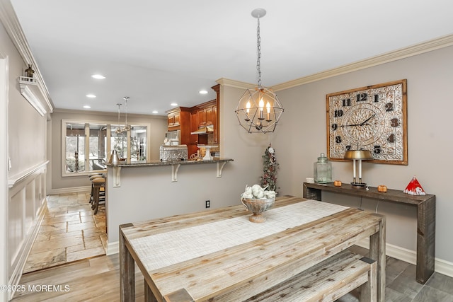 dining space featuring recessed lighting, baseboards, stone tile flooring, and ornamental molding