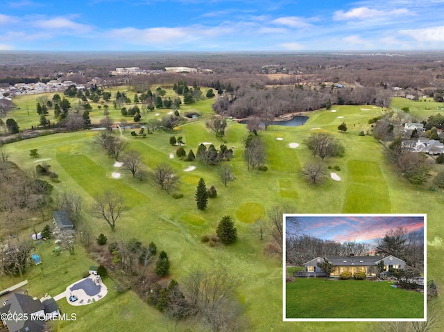 birds eye view of property featuring view of golf course