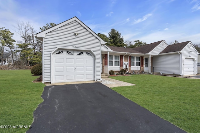 ranch-style house with an attached garage, driveway, and a front lawn