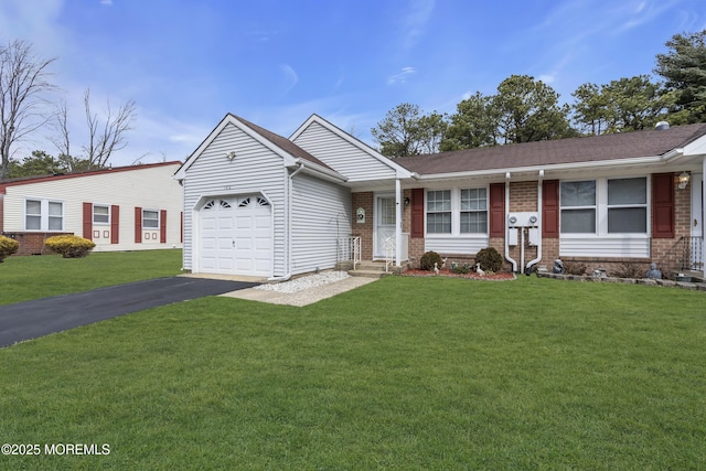 ranch-style house featuring brick siding, a front yard, an attached garage, and aphalt driveway