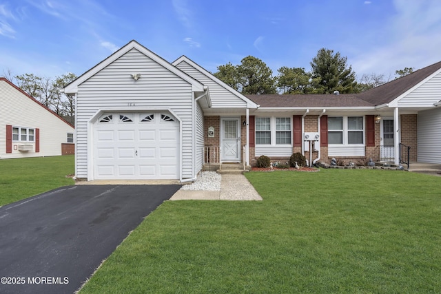 ranch-style home with an attached garage, a front yard, aphalt driveway, and brick siding