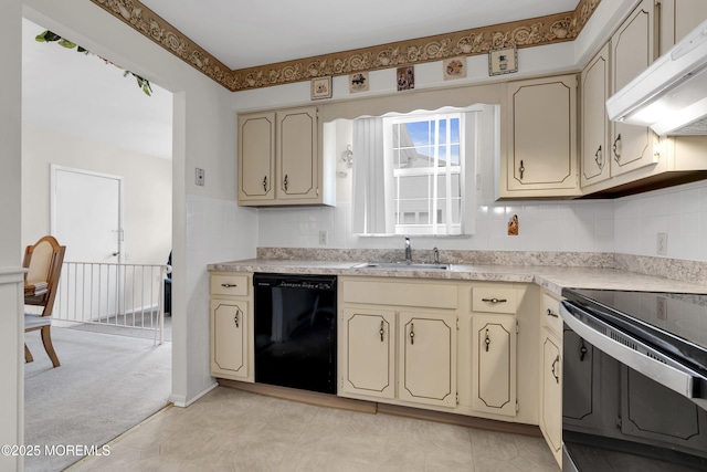 kitchen featuring cream cabinets, under cabinet range hood, a sink, black dishwasher, and light countertops