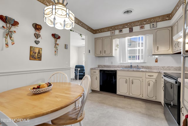 kitchen with electric range, visible vents, dishwasher, a wainscoted wall, and light countertops