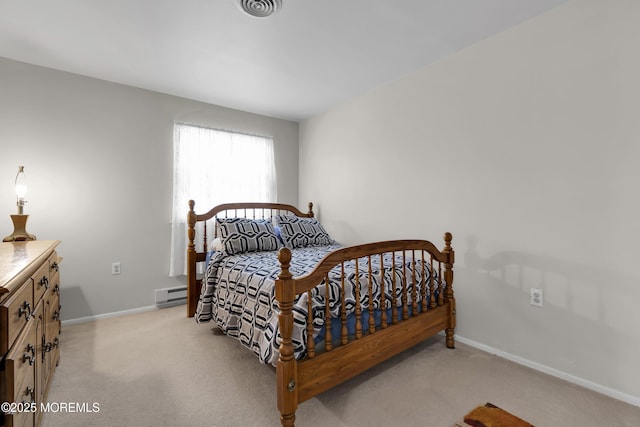 bedroom featuring light carpet, a baseboard heating unit, baseboards, and visible vents