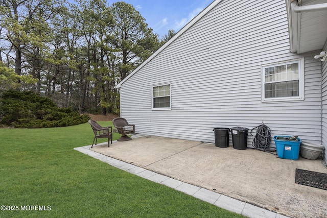 exterior space featuring a lawn and a patio area