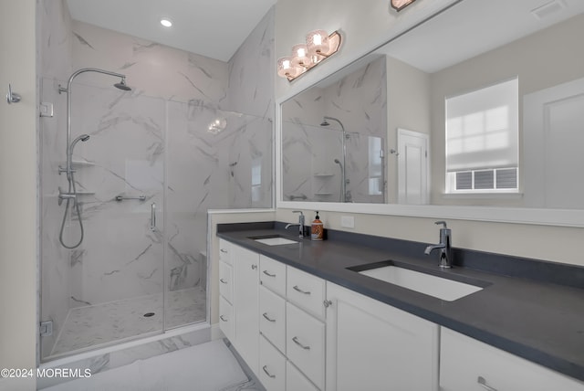 full bath with visible vents, a sink, and a marble finish shower