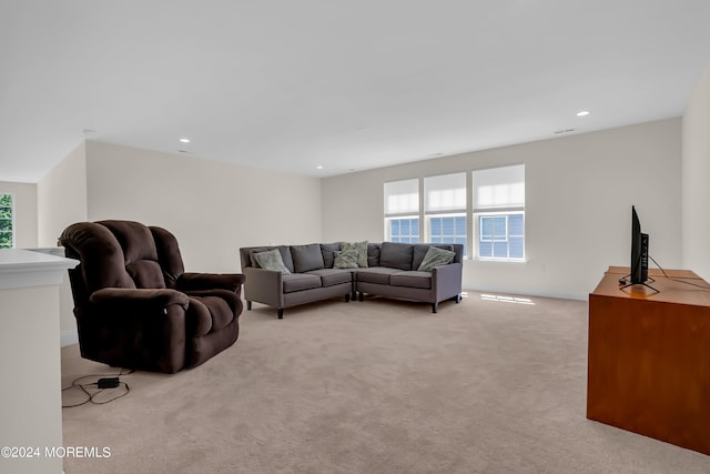 living area with a wealth of natural light, carpet flooring, and recessed lighting