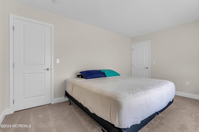 bedroom with carpet flooring and baseboards