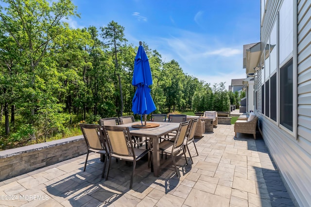 view of patio featuring outdoor dining area