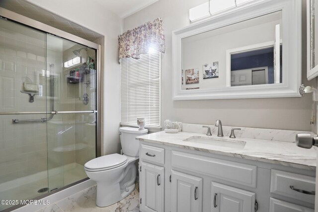 full bathroom featuring a stall shower, marble finish floor, vanity, and toilet