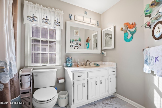 bathroom featuring baseboards, toilet, marble finish floor, curtained shower, and vanity