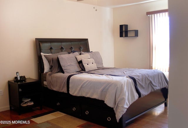 bedroom with wood finished floors